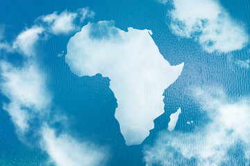 Poster - Continent of Africa map shaped clouds on blue ocean, sea background. Environment and Eco concept.