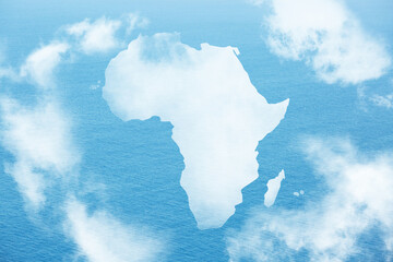 Poster - Continent of Africa map shaped clouds on blue ocean, sea background. Environment and Eco concept.
