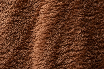 Wall Mural - Texture of a brown faux fur as a background.