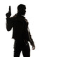 © ana - Silhouette of a tough black man holding a gun. Isolated white background with copy space. Private detective. Investigator. Mystery, thriller, action packed pose. Back light. African american man