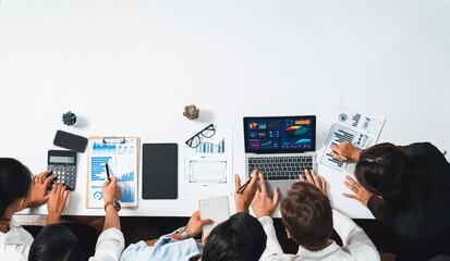 Group of office worker and businesspeople working on business financial data analysis. Empty space with editable blank background meeting table for customer design. Prudent