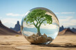 Tree in glass ball on soil crack in desert