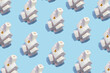 © SLV - Pattern made with 3d porcelain white house with chimney shape lanterns on bright blue background. Creative minimal art. Flat lay. Copy space. Minimal composition. Minimal wallpaper