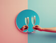 Hands holding champagne glasses making a toast through a circular mirror. Celebration, cheers pink and blue background