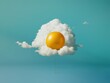 Yellow ballon floating in front of a fluffy cloud. Fried egg association background.