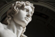 a closeup of a marble sculpture of a face looking upward in a museum under an arch
