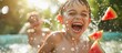 © Dougie C - A young boy with short hair and a big smile having fun throwing watermelon slices in the water.