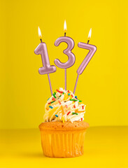 Number 137 candle - Birthday card design in yellow background