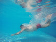 © biletsky - Beard man with glasses diving in a pool