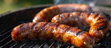 Two Delicious Sausages Are Being Grilled On A Homemade Grill.