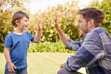 Canvas Print - High five, kid and man in park for family adventure, support and motivation with development. Dad, boy child and happy with excited hand gesture for success, teamwork and happiness together in garden