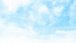 Vector blue sky background with tiny clouds. Beautiful clouds on a blue sky as background