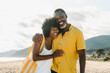 © oneinchpunch - Beautiful mature black couple of lovers dating at the seaside - Married african middle-aged couple bonding and having fun outdoors, concepts about relationship, lifestyle and quality of life