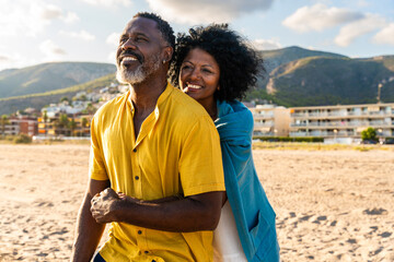 beautiful mature black couple of lovers dating at the seaside - married african middle-aged couple b