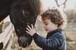 The boy hugs the horse's muzzle.Friendship between a child and an animal.