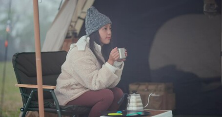 Wall Mural - Woman enjoy the hot coffee with camping tent