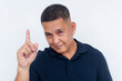© Mdv Edwards - Confident middle-aged Asian man gesturing , possibly a tip or idea while looking at the camera, isolated on a white background.