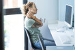 © simona - Tired woman worker sitting at the desk massaging neck and shoulders for overwork online activity. Bad posture painful. Stressed female people in office job workplace alone. Using computer too much