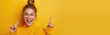 Surprised, shocking, excited young woman with her mouth open on a yellow background. ?opy space for text.Banner