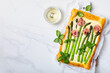 Asparagus puff pastry tart with prosciutto roses and mascarpone or cream cheese. Mother's Day breakfast recipe idea