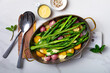Roasted spring vegetables - asparagus, radishes, baby potatoes with hollandaise sauce