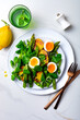 Grilled green asparagus, roasted new baby potatoes, fresh corn salad leaves, soft boiled egg, peas and green herb oil salad.