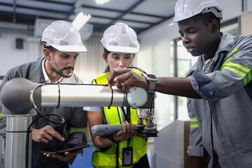 Wall Mural - group of diverse people working on robot programming in robotic and electronic engineering laborator