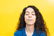 © VISTA by Westend61 - Woman with butterfly sticker on lip against yellow background