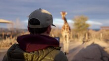 BTS Wildlife Cinematographer Filming Girafee On Back Of Truck Handheld Shaky Safari