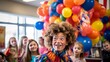 © javier - Determined clown twists colorful balloons for kids