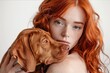 studio fashion shot of natural beauty red haired perfect skin girl with Hungarian Shorthair vizsla