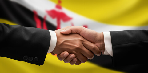 Businessman and diplomat in suits clasp hands for handshake over Brunei flag, agree on united success in trade, diplomacy, cooperation, negotiation, support, teamwork in commerce, gesture of greeting