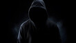 Dark man silhouette. Hacker in the hoodie on the dark