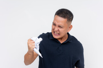 A angry middle aged man venting out by crumpling a piece of paper. Furious about an impending divorce. Isolated on a white background.