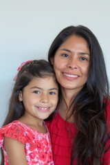 A mother and daughter stand together, smiling brightly for a photo.. Fictional Character Created By Generated By Generated AI.