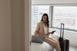 © ReeldealHD images - Business executive in hotel working using her cell phone