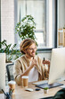 © LIGHTFIELD STUDIOS - cheerful male professional in glasses looking at monitor near coffee and graphic tablet on desk