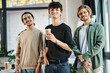 © LIGHTFIELD STUDIOS - Three young men in their 20s with coffee in a friendly office atmosphere, professional headshot