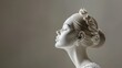 © NK - White Statue of a Woman With a Flower in Her Hair