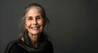 © Mali Jaroo - Portrait of a Happy Older Woman. Beauty of Old Days. Grey Background. Copy Space.