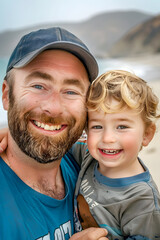 Man with beard and cap on the beach enjoying with his son, vertical photo