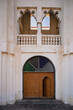 Doha, Qatar - February 8, 2024: Double-leaf wooden gate with glass in a heritage building in Souq Waqif, Doha, Qatar