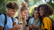 group of teenagers looking at their mobile phones