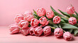 Beautiful composition spring flowers. Bouquet of pink tulips flowers on pastel pink background.Generative AI
