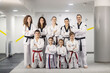 © Dusan Petkovic - Portrait of taekwondo girls and boys posing in martial art school with their trainer.