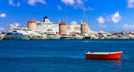 Wall Mural - Greece travel, Dodecanese. Rhodes island.  Mandraki Harbor with cruise ships and old windmils