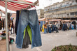 Worn jeans and pants sold at the flea market in Tel-Aviv, Israel. Selling second hand clothes.
