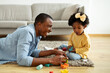 © Prostock-studio - Beautiful little black girl enjoying time with her daddy