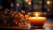 Close-up of candle with soft warm background behind it