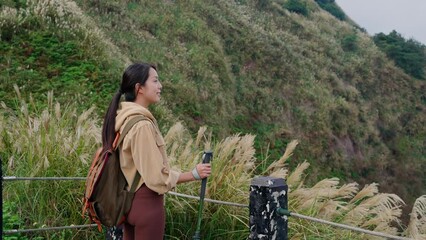 Poster - Woman go hiking with trekking pole and walk though the mountain